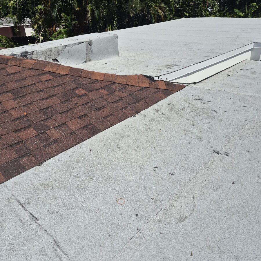 Flat roof section meeting a new shingle roof in Hollywood